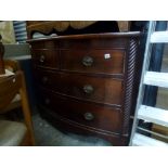 A 19th century mahogany bow-fronted chest of two short over two long drawers flanked by ribbed