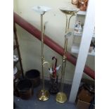 Two brass floor-standing adjustable standard/reading lights and a brass umbrella stand and