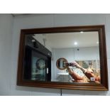 A mahogany framed bevel glass rectangular mirror. FOR DETAILS OF ONLINE BIDDING ON THIS LOT