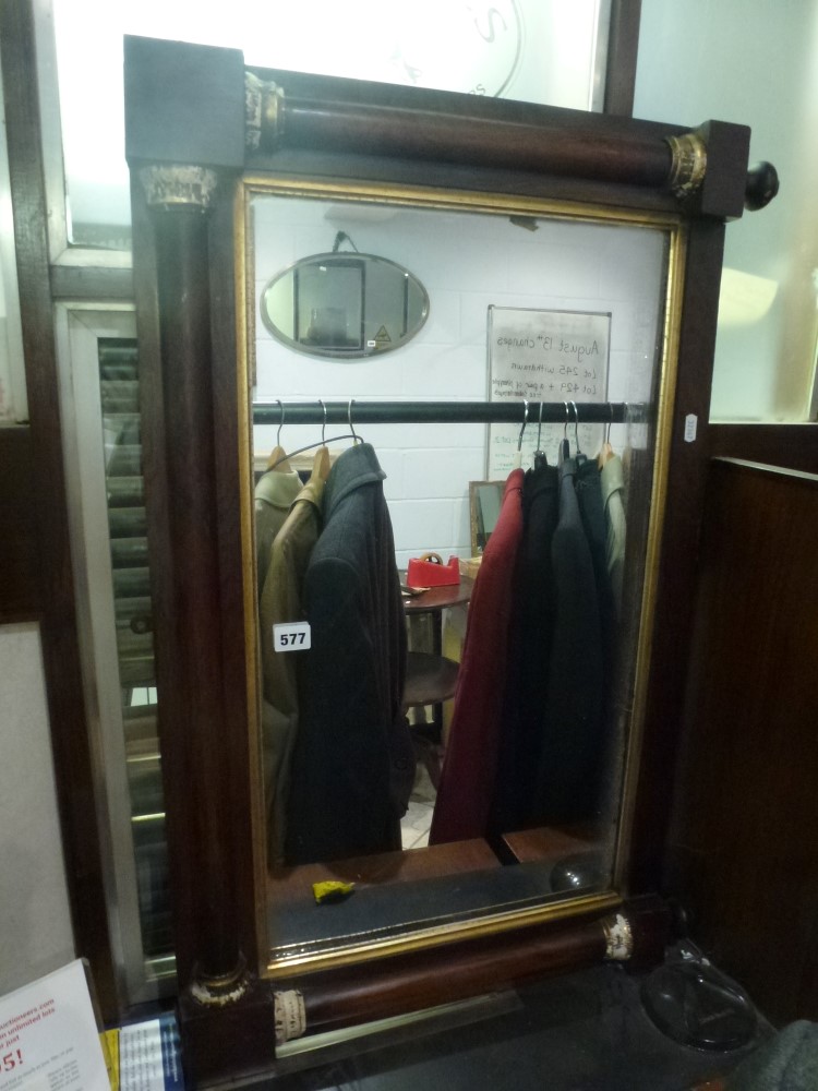 A mahogany rectangular overmantel mirror with pillar supports. FOR DETAILS OF ONLINE BIDDING ON THIS