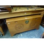 A Burmese coffer with carved front, panel and lid with inner tray, lined in camphor. FOR DETAILS