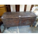 A 17th century small oak coffer with carved front panel FOR DETAILS OF ONLINE BIDDING ON THIS LOT