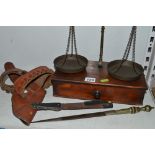 A Victorian brass balance on mahogany base with a drawer, together with weights, two spring