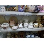 Two shelves of mixed china including part tea services by Mintons and Royal Doulton Carnation