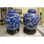 A pair of large Chinese blue and white porcelain covered ginger jars, late 19th century, decorated