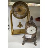 A 19th century bronze mantel timepiece cast with medieval figures and fitted with an earlier watch