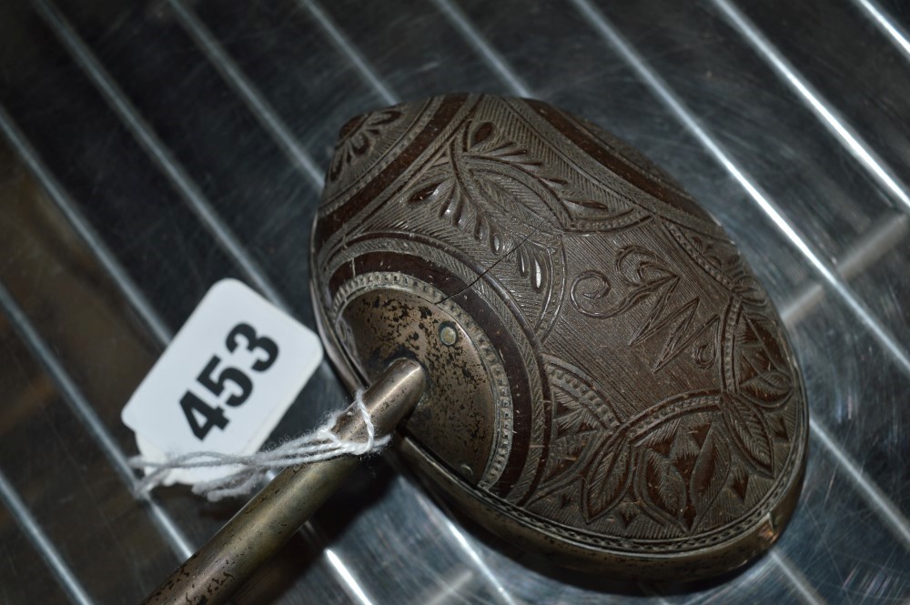 A Georgian punch ladle, the coconut bowl carved with leafy motifs and JW monogram and silver- - Image 2 of 2