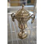 A fine small silver trophy cup and cover, in 16th century style, with vine-hung handles and stem,