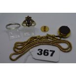 A platinum band ring, 2.5 gm; a 15 ct gold stud back, 1 gm; a 9 ct gold snake pattern guard and 9 ct