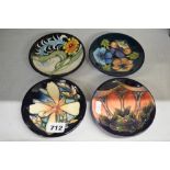 Four modern Moorcroft small dishes variously decorated with stylised flowers, dated 2004-2007, 4.6