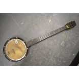 A vintage wooden banjo [next to s83] TO BID ON THIS LOT AND FOR VIEWING APPOINTMENTS CONTACT