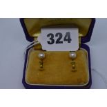 A pair of cultured pearl earrings on 9 ct gold mounts TO BID ON THIS LOT AND FOR VIEWING