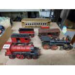 Vintage cast iron model floor trains, circa 1900s, including two locomotives, one possibly Hubley,