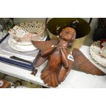 A 19th century carved wooden bust of an angel, a heavy brass and copper jam pan, a 19th century