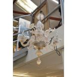 A Venetian pink glass five-branch chandelier with flower and leaf decoration TO BID ON THIS LOT