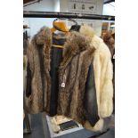 A lady's fashion coat in ivory mink and pale fox fur, with gathered cuffs and toggle fastening,