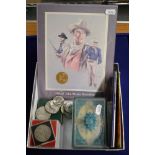 14 crowns, one celebrating the Festival of Britain 1951, other coins, a glass box containing