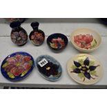 Seven small pieces of Moorcroft, vintage and later, comprising: a small vase and small bowl with