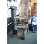 A heavy cast iron garden water pump feature with moulded decoration TO BID ON THIS LOT AND FOR