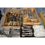 Mixed cutlery, including EPNS asparagus tongs and other items, knives, Thai bronze, etc., in a small