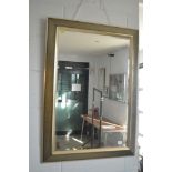 A black and gilt rectangular framed bevelled glass mirror TO BID ON THIS LOT AND FOR VIEWING