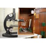 A microscope signed Cooke, Troughton & Simms Ltd, York, England, M1086161, in black with silvery