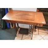 A Singer treadle sewing machine TO BID ON THIS LOT AND FOR VIEWING APPOINTMENTS CONTACT BAINBRIDGES.