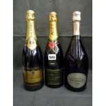 Three bottles of champagne: Moet & Chandon Brut Imperial, 1992; Henriot Brut, 1998; De Meric,