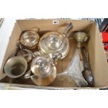 A small carton containing a silver-plated circular tea set and a few other items, including a