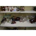 A shelf of glassware including comports, fruit bowls, vases, a decanter and stopper with brandy