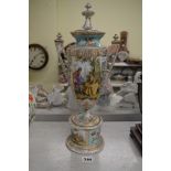 A Dresden-decorated German porcelain two-handled vase with cover, with figures on sky-blue ground,