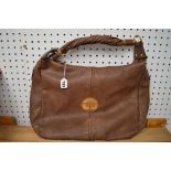 A large donkey brown leather Mulberry handbag with twist handle [upstairs shelves} TO BID ON THIS