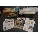A shoebox full of mid-20th century First Day Covers, and two boxes containing postcards and early