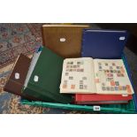 A stamp lot in 12 albums including mint sheets, a stock book, an album of First Day Covers