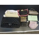 A quantity of handbags including a black quilted style shoulder bag, clutch bags and purses