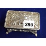 An Edwardian silver large ring box, on four scroll legs, with green velvet interior, 4.3 in long,