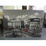 A large board-mounted photographic print, 'Piccadilly Circus', with two red London double-decker