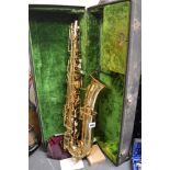 A cased brass Buescher saxophone [by s83] TO BID ON THIS LOT AND FOR VIEWING APPOINTMENTS CONTACT