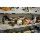 A shelf of mixed china including a Royal Doulton Dick Turpin character jug HN 6528, Portmeirion
