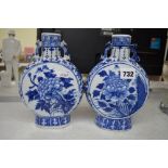A pair of Chinese blue and white porcelain moon flasks, circa 1900, painted with peony on a lotus