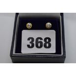 A pair of diamond ear studs, each of about 25 points, collet-set in yellow gold, 2.3 gm TO BID ON