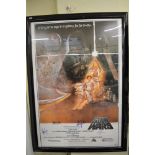 A framed Star Wars poster bearing signatures [next to s70]