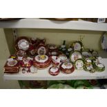 A collection of miniature Limoges plates, jugs, trinket boxes and covers and ornaments in pink and