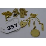 9 ct gold, comprising: four various small pendants, an onyx pendant, a heart padlock clasp, and four
