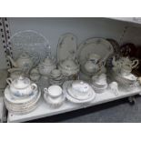 An extensive part tea and dinner service decorated with blue flowers, a small quantity of glassware,