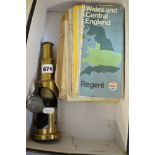 A vintage brass monocular microscope and a small quantity of road maps [C] TO BID ON THIS LOT AND