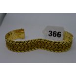 A 750 gold chevron-pattern flexible cuff bracelet, 44.7 gm TO BID ON THIS LOT AND FOR VIEWING