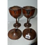 A pair of unusual goblet-shaped caddies, probably Continental, in fruitwood, with octagonal bowls