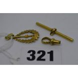 An 18 ct gold fob chain bar and clasp, 4.08 gm, and a 9 ct gold pendant, 1.6 gm TO BID ON THIS LOT
