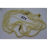 Four cultured pearl necklaces, one with 14 ct gold clasp, the remainder with 9 ct clasps TO BID ON